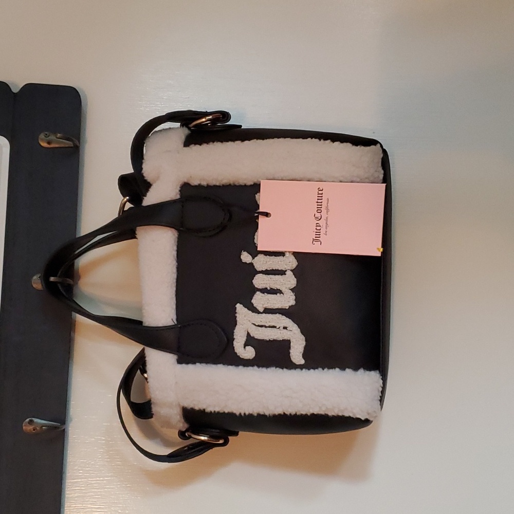 Juicy couture small handbag.black and white.with small black pouch.